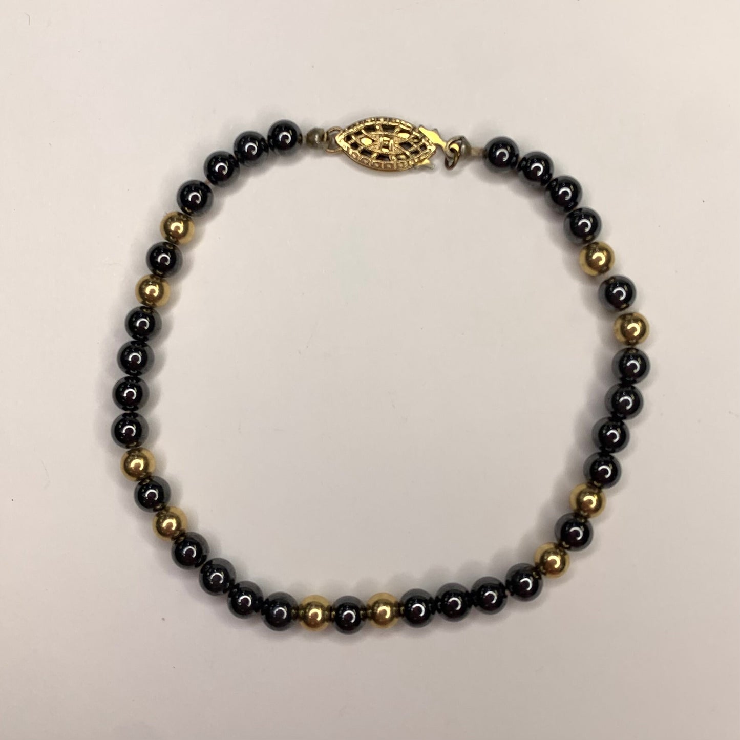 Hematite and 10 Karat Gold Beaded Bracelet