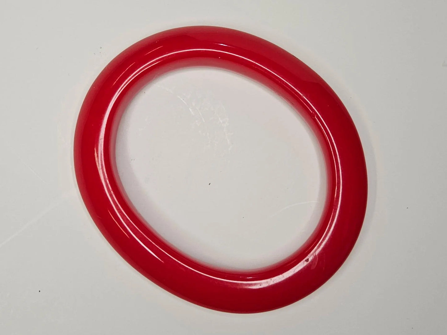 1950s Red Plastic Bangle- Oblong Sculpted Outer Edge