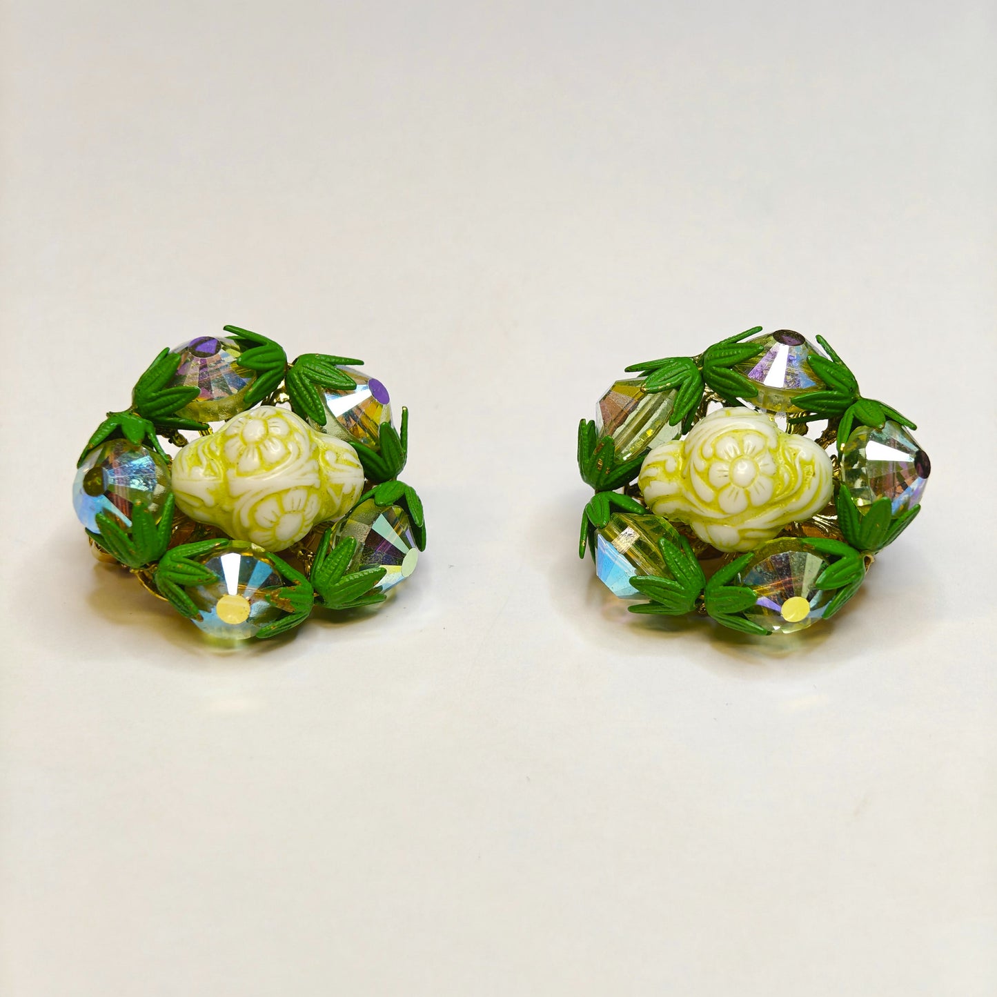 with Green Crystals Surrounding a Creamy Carved Center Settings - Hobe Earrings in Green and Cream