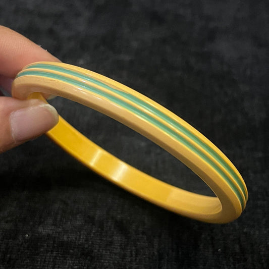Yellow Bakelite Bangle Carved with Green Stripes